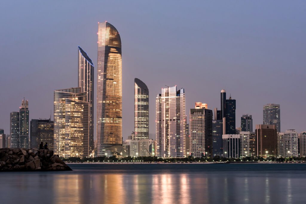 abu dhabi seascape with skyscrapers in the background at evening